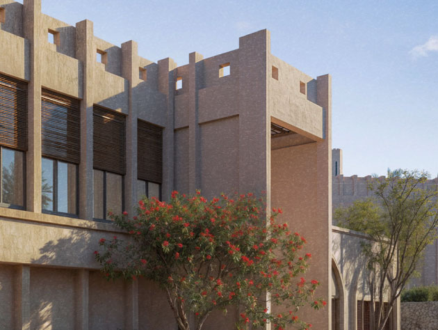 Modern low-rise building framed by flowering shrubs and trees