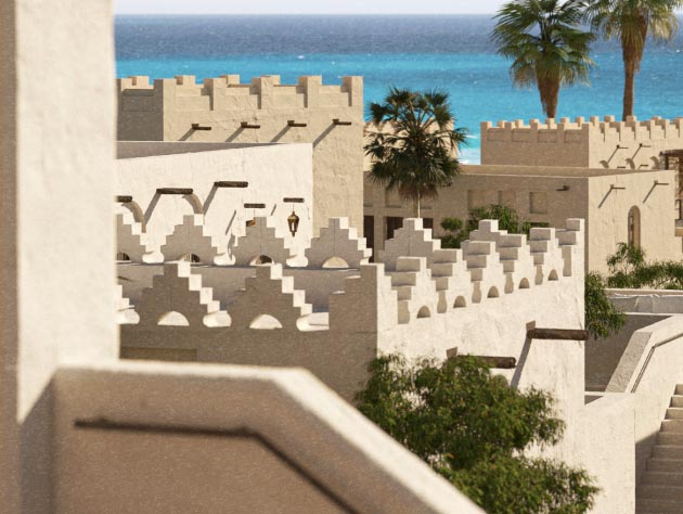 Stepped rooftops of a coastal community with palms and the sea beyond