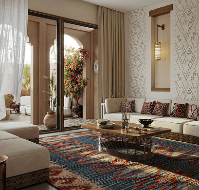 Furnished living room with a patterned rug opening onto a planted courtyard