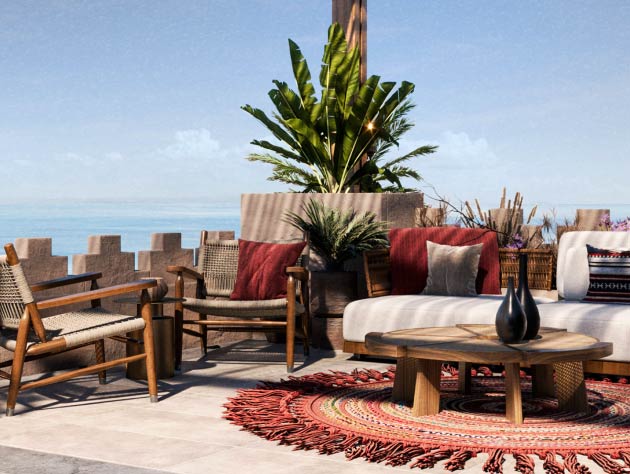 Rooftop terrace with lounge seating overlooking a coastal development