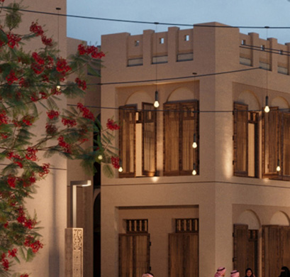 Residential building with mashrabiya screens lit at dusk with hanging lights